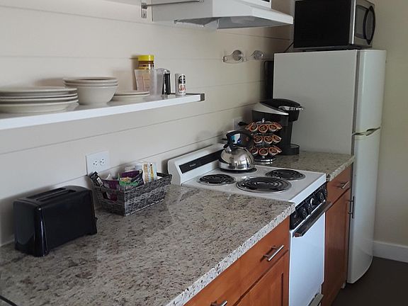 updated kitchen with new cabinets and granite countertops