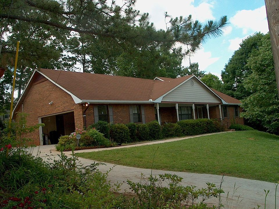 Front view w extended drive 2 car garage