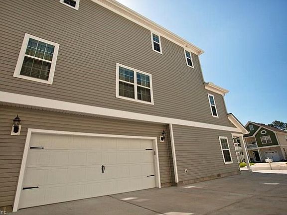 Side View. 2 Car Garage.