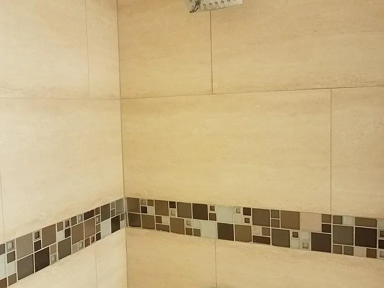 Open shower with glass divider. Nice designer touches throughout. Designed with love and attention.