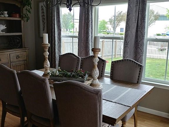 DINING ROOM THAT IS OPEN AND BRIGHT. OPENS UP TO THE PATIO WITH FIRE PIT.