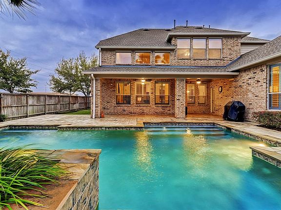Large covered patio with stamped concrete deck. Gas line is available for your grill.