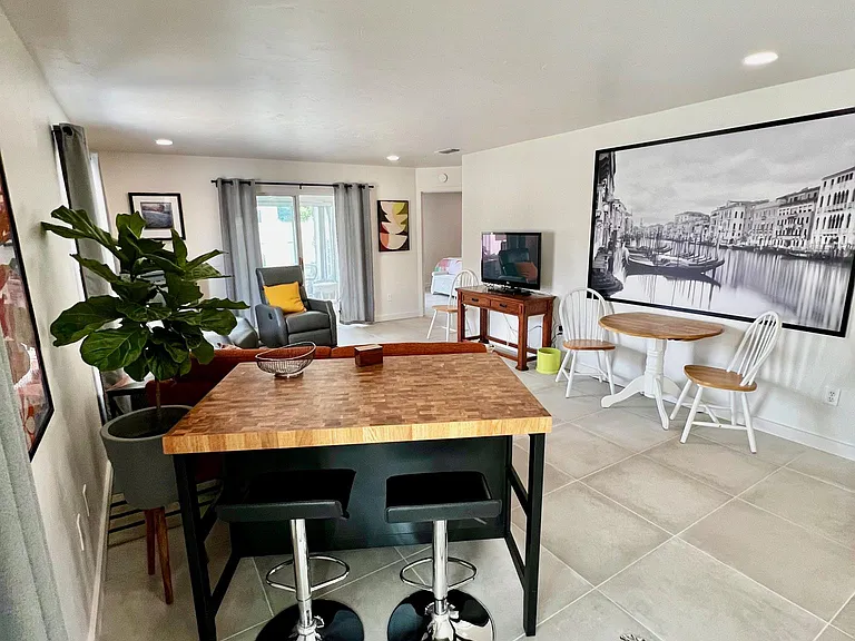 Small dining table with 4 chairs and a counter height table with 2 stools