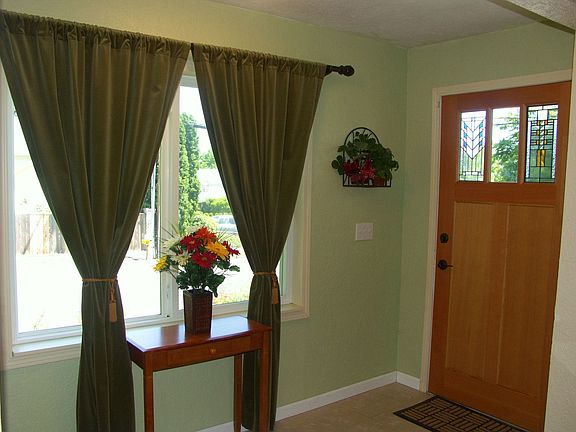 entry way w/ new door and front porch w/ trek decking