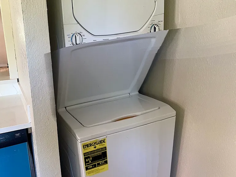 Washer/dryer combo adjacent to kitchen