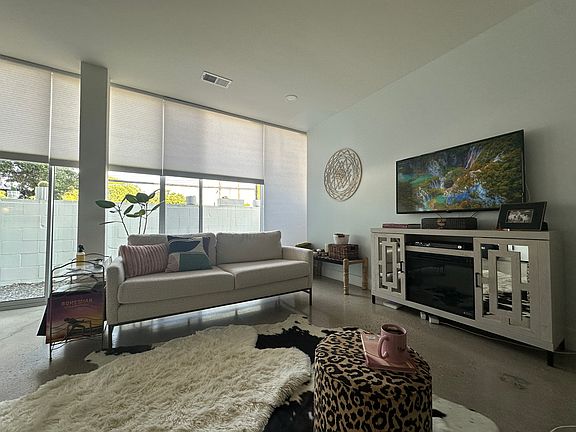 Automatic floor to ceiling powered blinds are light and sound filtering.