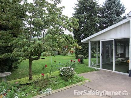 Screened in patio with additional outside patio area