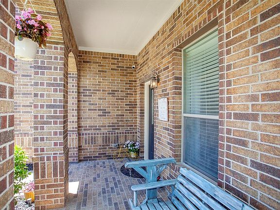 A shady front porch welcomes you home...