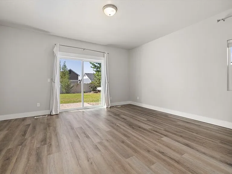 Primary bedroom with slider to backyard