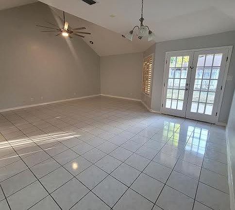 Formal dining area. Doors lead to backyard.