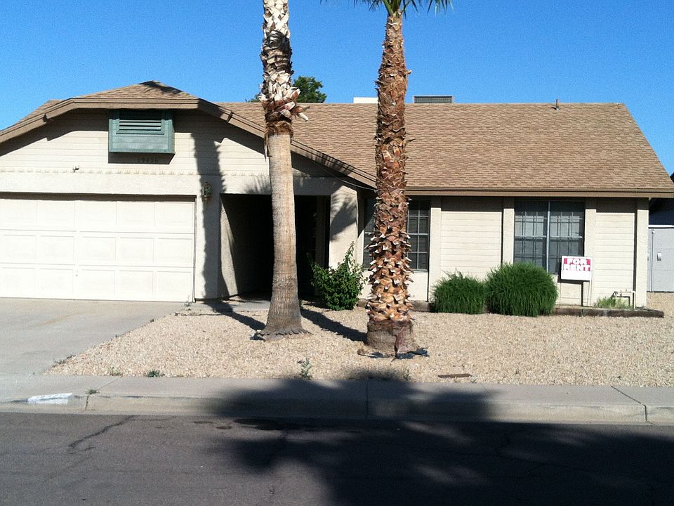 Mature palms and security door.