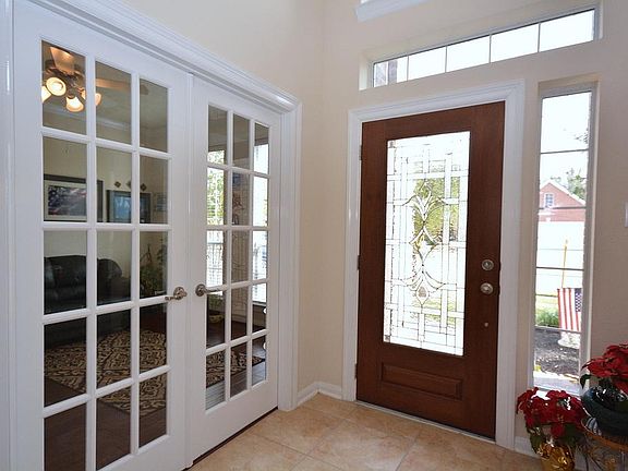 At the entry you see the study with divided light french doors. Don't forget that this Energy Star home built in 2008 is extremely energy efficient with radiant barrier in the attic,double paned windows,14+ SEER HVAC and programmable thermostat