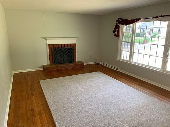 living room with wood burning fireplace