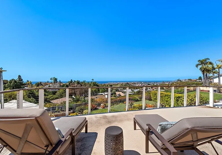 Expansive ocean-view balcony with room to lounge and soak in the sunset.