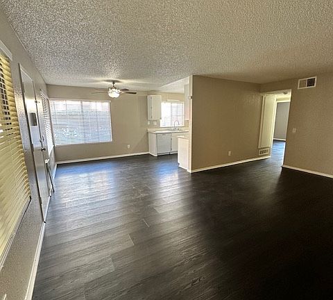 View from corner of the living room towards dining area/kitchen