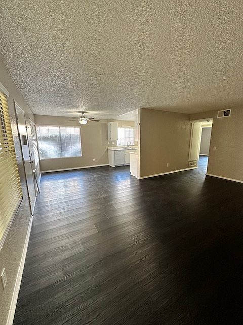 View from corner of the living room towards dining area/kitchen