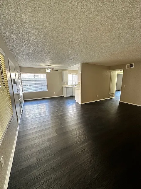 View from corner of the living room towards dining area/kitchen