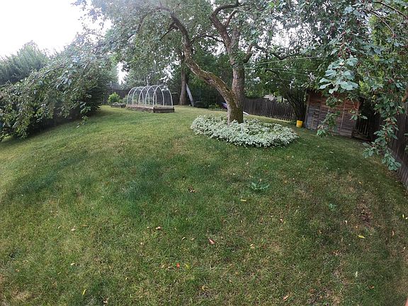 The large back yard offers just the right amount of shade and sun for relaxing and growing a good garden.