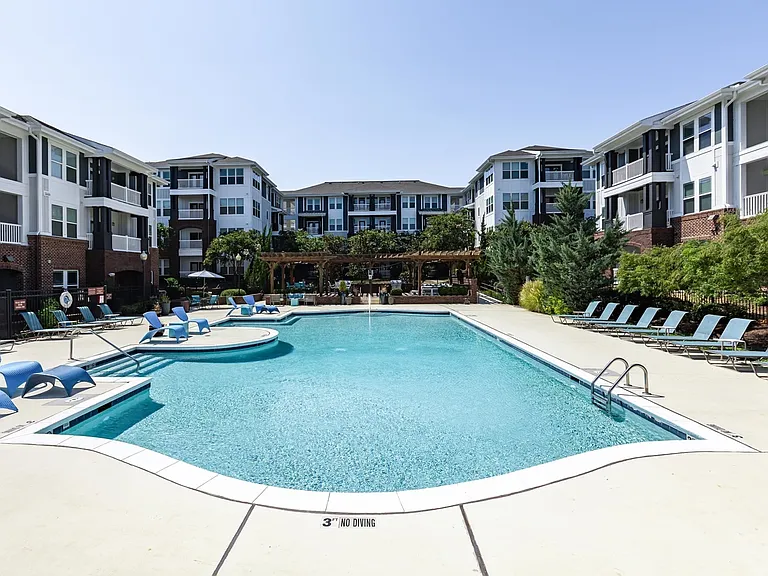 Sparkling Pool Area with Sun Deck