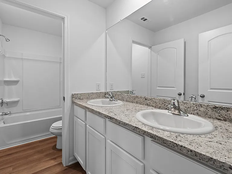 Dual sink vanity in upstairs bathroom.