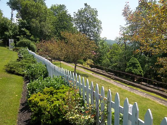 extensive manicured lawns