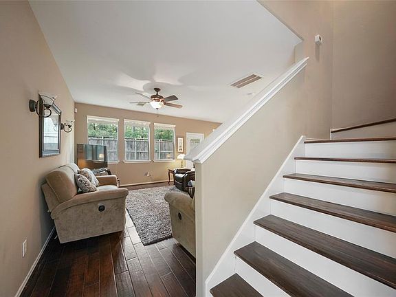 Just beyond the entry are the hardwood stairs that lead to the flex space, 3 bedrooms, 2 full baths and the laundry room.