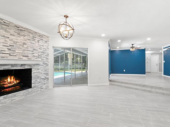 Living room with a breakfast nook or sitting area to the right