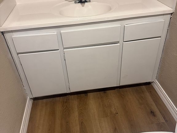 Primary bathrom vanity with new countertop and new floor!