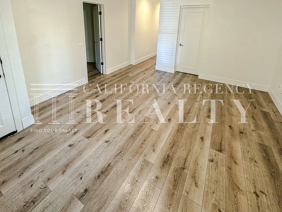 Spacious living area with updated finishes and flooring.