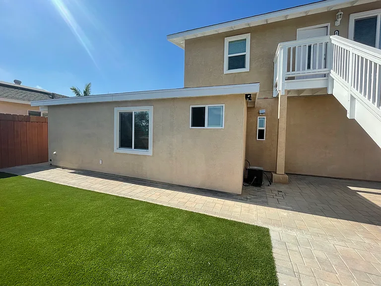 Backyard with turfed lawn