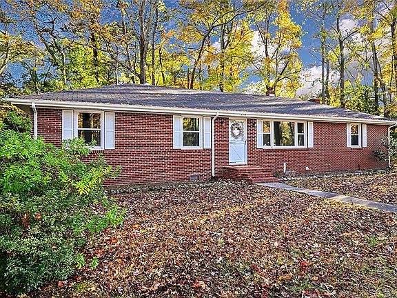 This renovated brick ranch will Wow you the moment you see it!