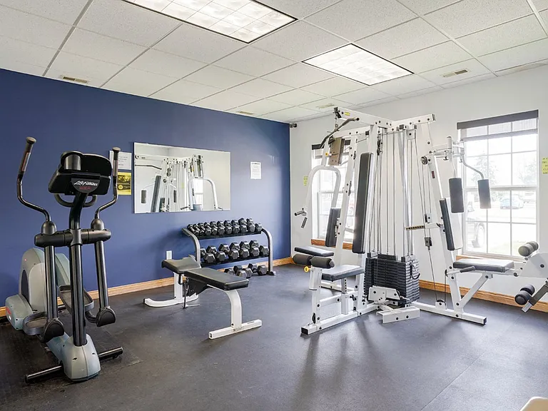 Enjoy the dumbbell weights and cable machine in our 24-hour fitness center.