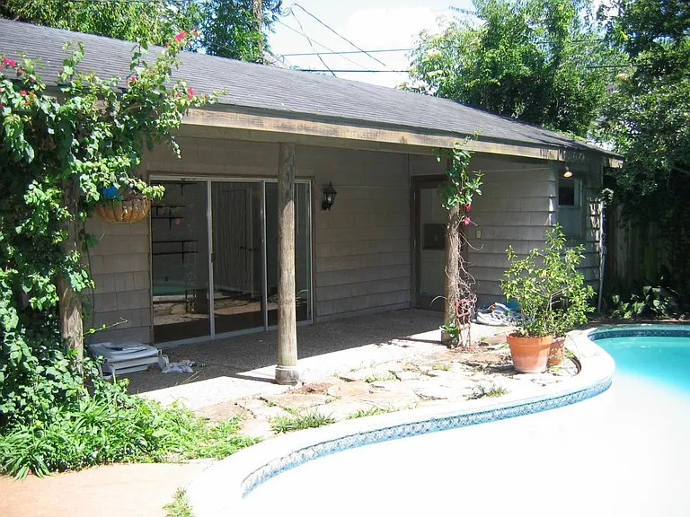 View of the back house studio and pool