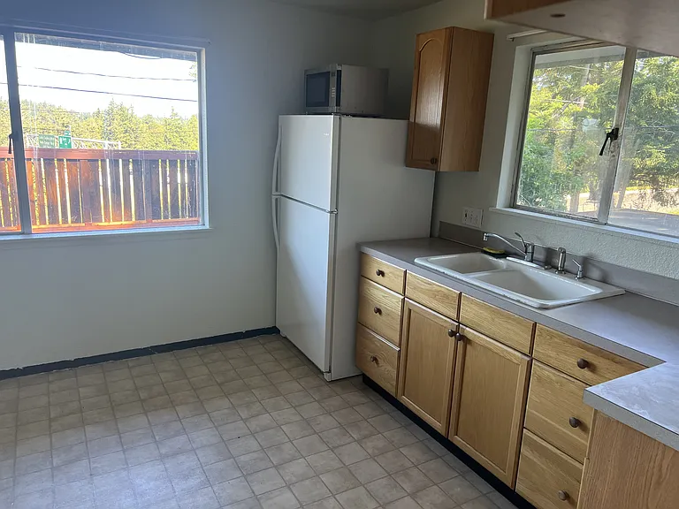 upstairs kitchen, view towards deck