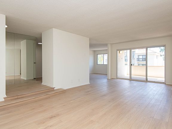 Spacious, Open Living Room with Balcony