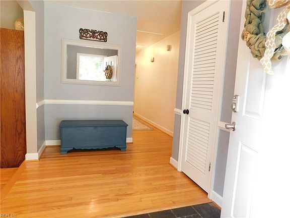 Classic slate flooring at wide, open foyer entrance. 