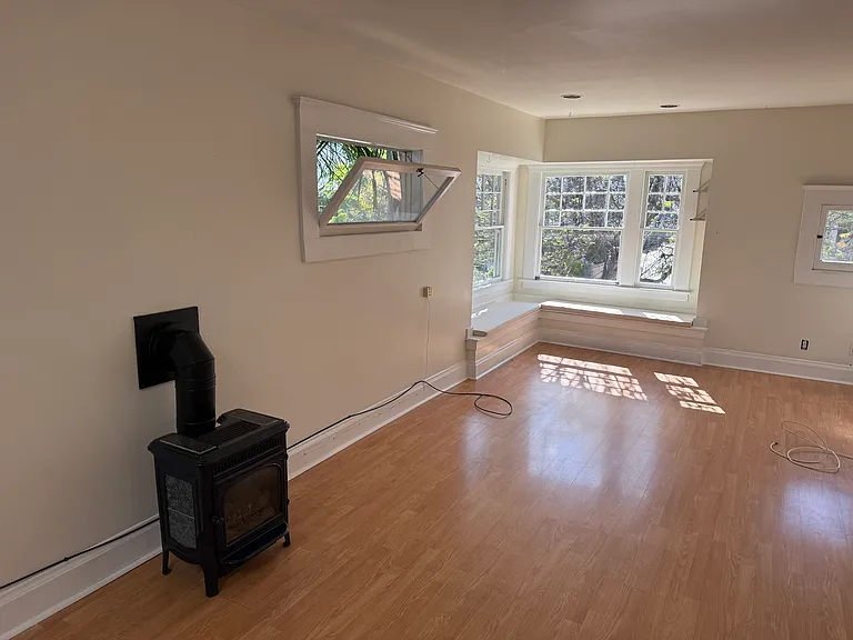 Living room with bay window seating.