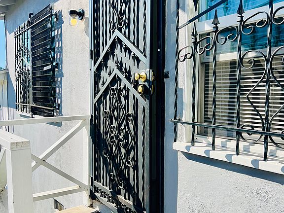 Private door entrance to a stand-alone apartment, providing enhanced privacy and a true sense of home.