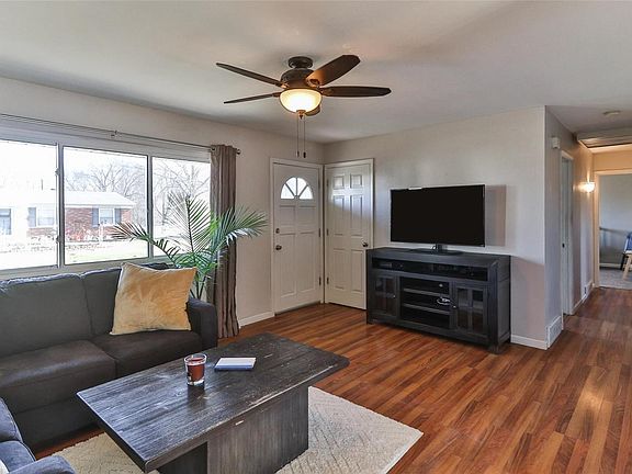 The main hallway off the living room accesses all three bedrooms and one of the two bathrooms.