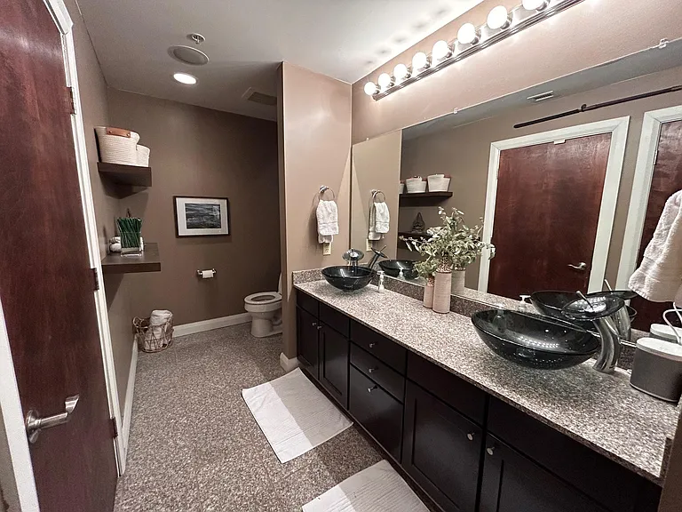 Full bath: walk in shower, two sinks, includes closet with stackable washer and dryer.