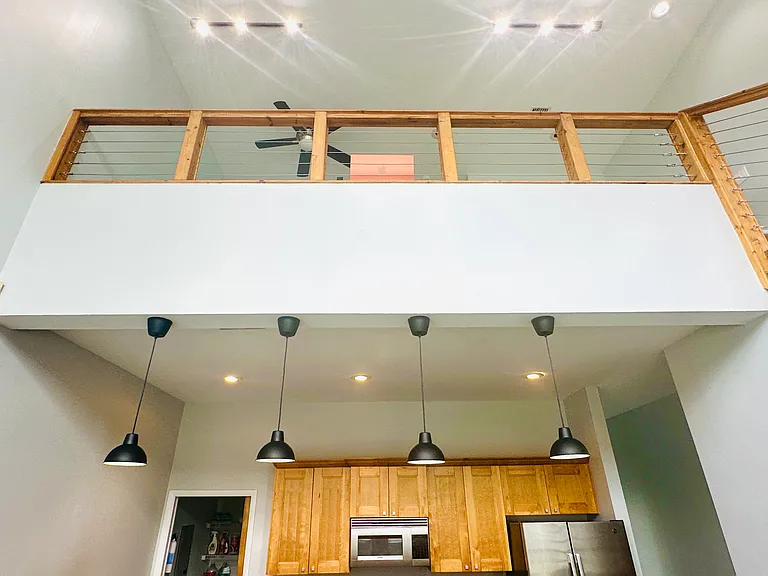 25 foot high vaulted ceiling with loft track lighting