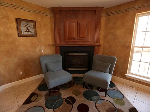 jaguar hearth area with fireplace and tv