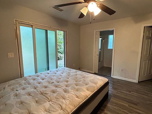 Master bedroom with walk-in closet. Master bedroom leads to rear yard