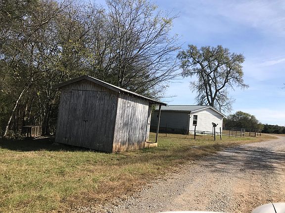 From the rear. Includes a storage building for yard tools &
