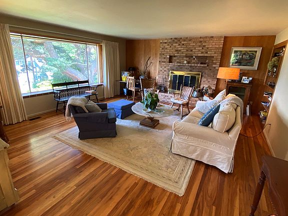 Spacious Living Room with FP. Main level has wood floors throughout.