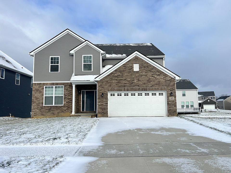 Front of House; 2-car attached garage with large driveway