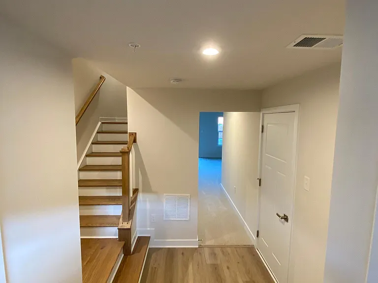 Entrance with powder room at left and garage on the right. Recreation room straight ahead.
