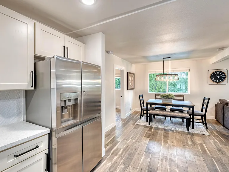 Another view of the kitchen and dining area