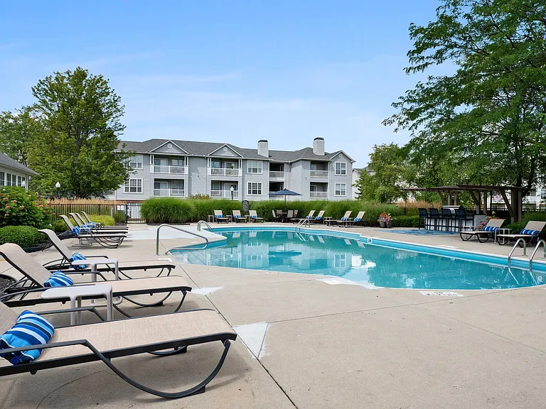 Swimming Pool with Sundeck and Lounge Chairs