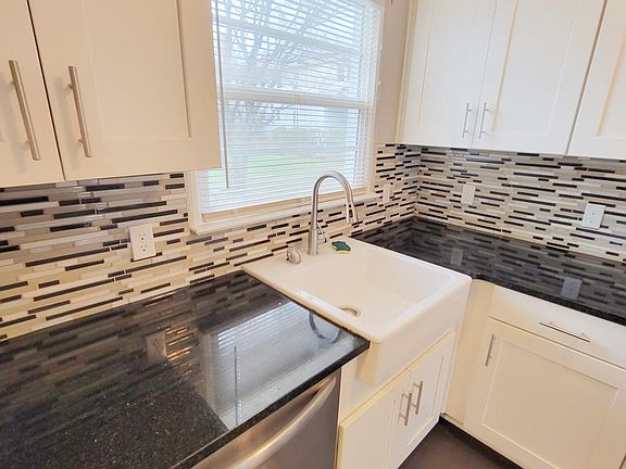 Granite counters and beautiful tile backsplash